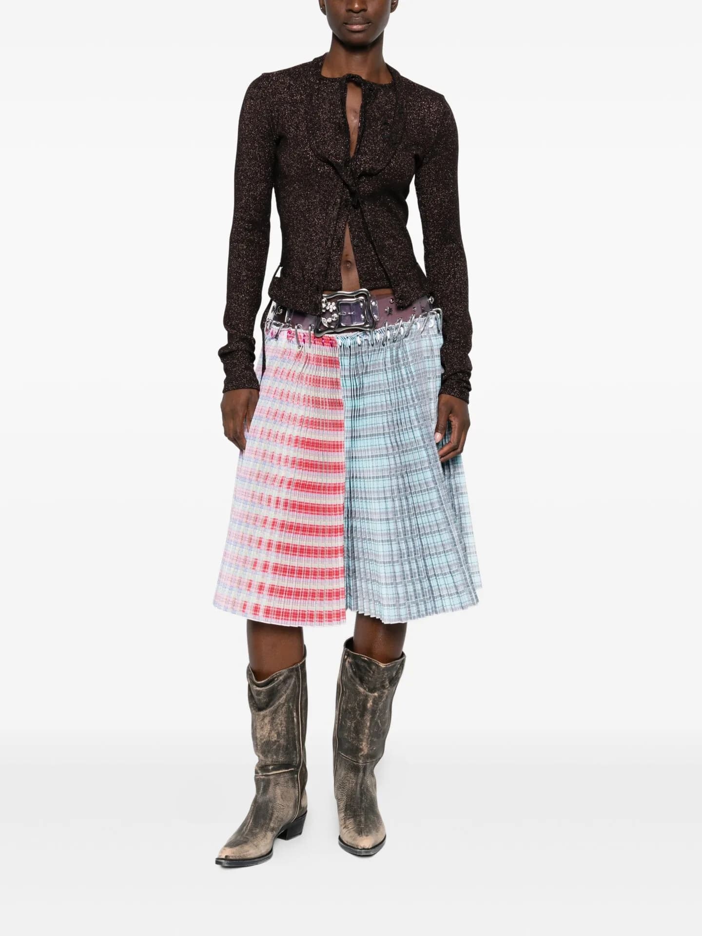 Brown lace top with a pleated skirt in pink and blue and grey cowboy boots