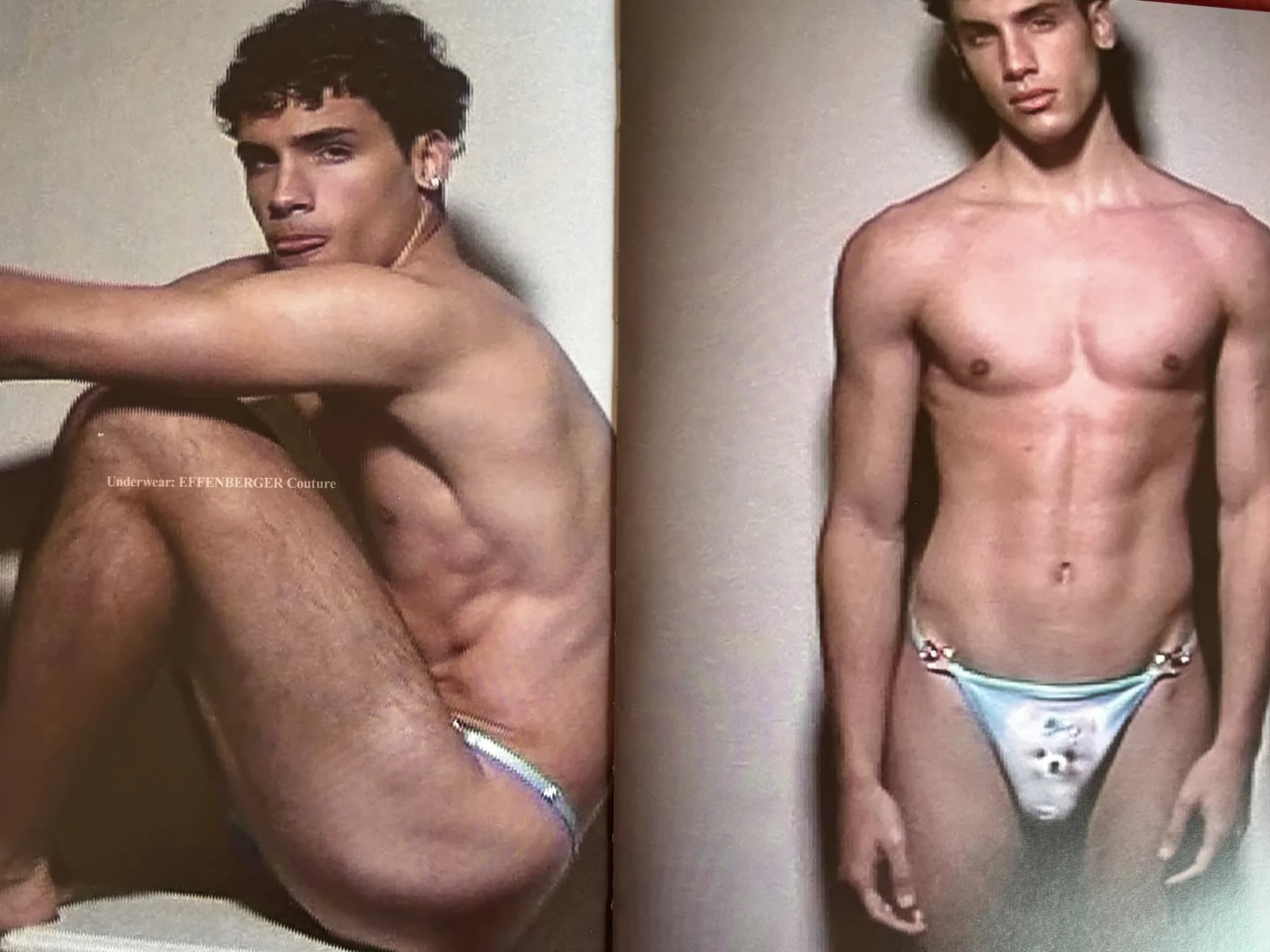 Magazine spread: model seated in briefs against a pink wall, facing a standing model in metallic briefs